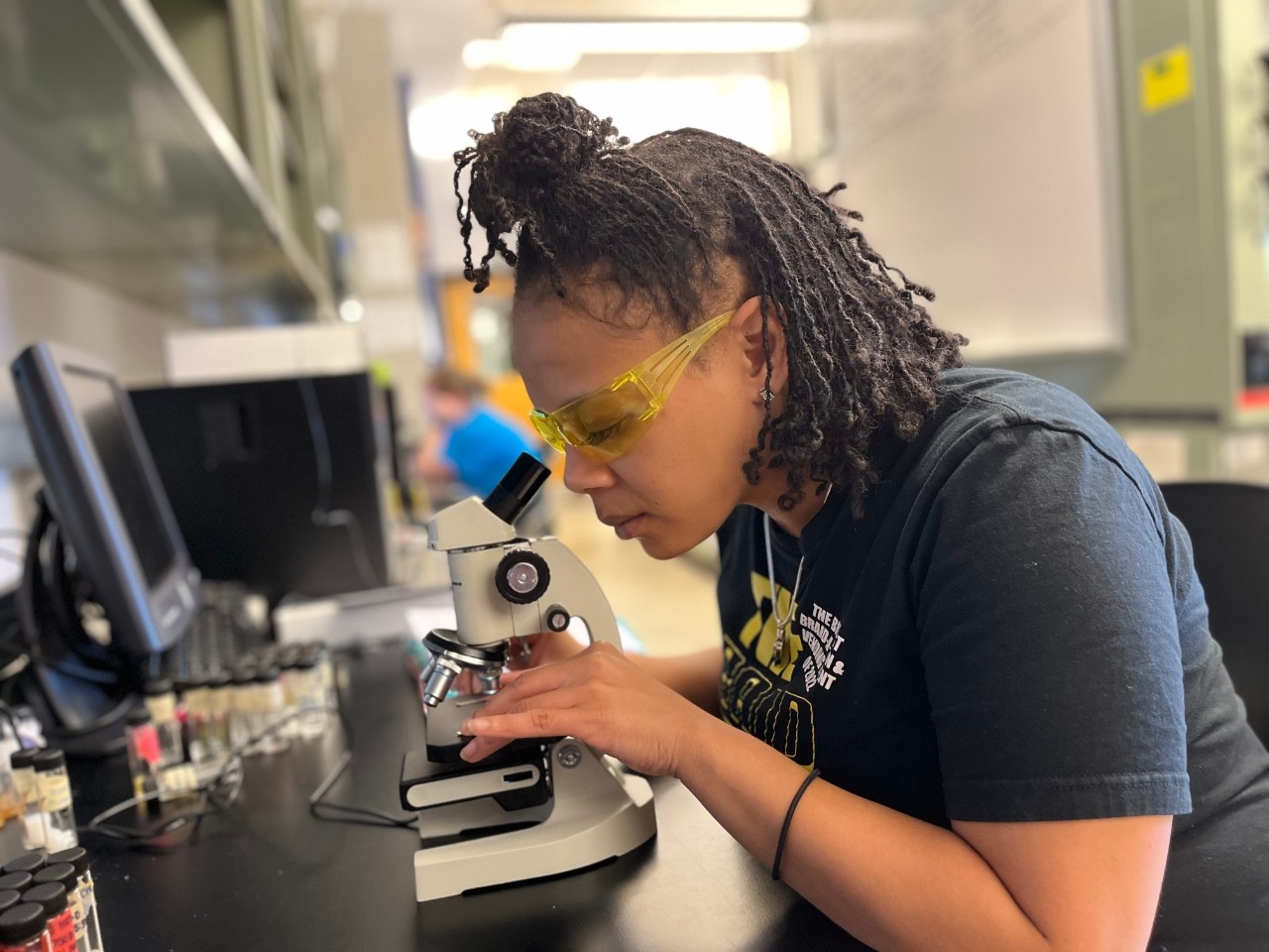 Student inside chemistry lab
