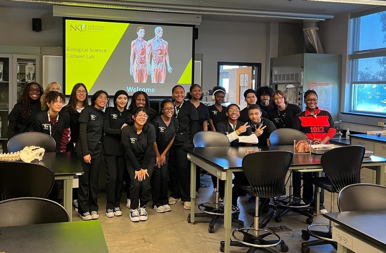 Group of high school students posing in a biology lab on NKU's campus.