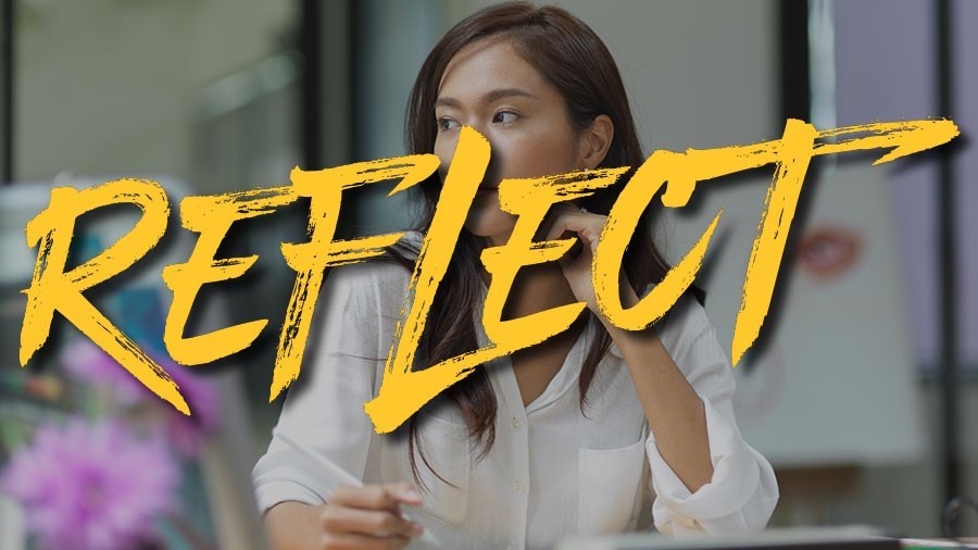 Thoughtful designer looking through the window - the word Reflect is superimposed